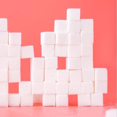 This is a gallery image of a with white cubes and a pink background.